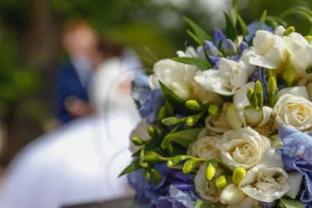 Wedding bouquet on a background of newlywedsの写真素材