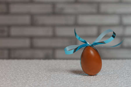 chocolate Easter egg with a ribbonの写真素材