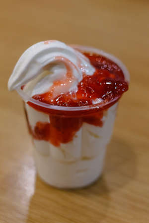Sundae with chocolate and strawberry cream on cafe