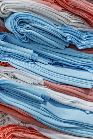 Rolls of fabric and textiles in a factory shop.の写真素材