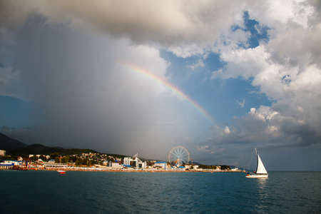 Picturesque landscape with blue water and a white yacht in the bay.の写真素材