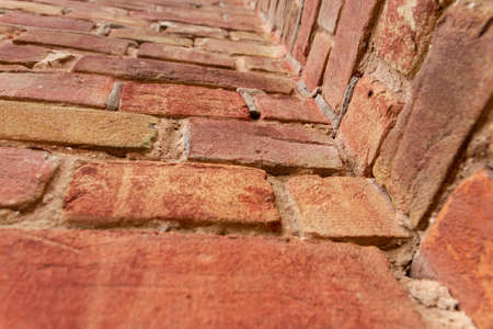 red brick wall texture grunge background with vignetted cornersの写真素材