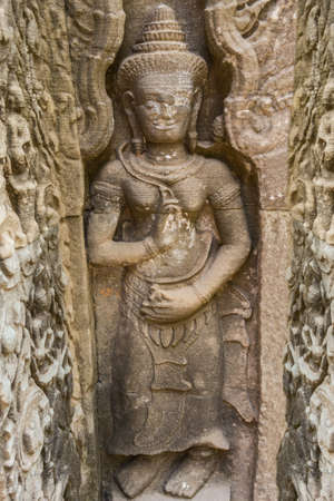 Khmer devata guardian shown in stone in Preh Khan temple, Siem Reap, Cambodiaの写真素材