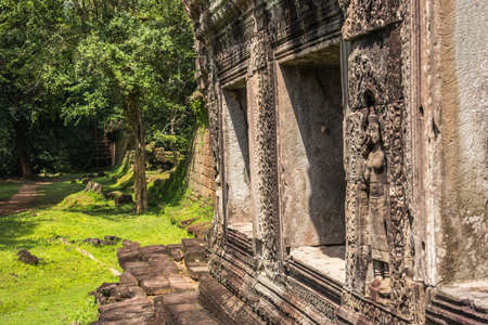 Khmer devata guardian shown in stone in Preh Khan temple, Siem Reap, Cambodiaの写真素材