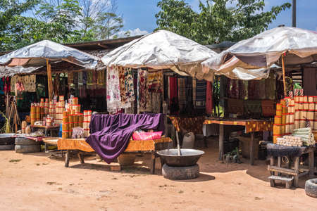 Vegetable and fruit and clothes market on the road, Cambodiaの写真素材