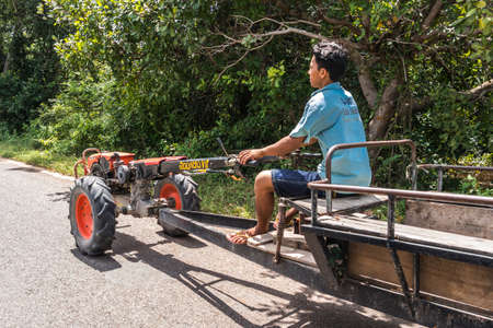ANGKOR, CAMBODIA - OCTOBER 19, 2016: A man's drivingのeditorial素材