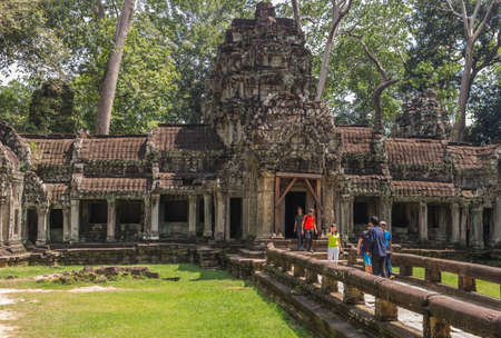People are walking in Ta Prohm temple in Angkor.のeditorial素材