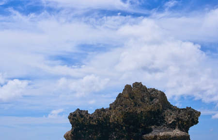 Rock stone view on the blue skyの写真素材