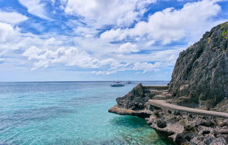 Rock cliff view from white beach on Boracay, Philippinesの写真素材