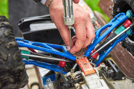 Man is repairing Radio-controlled carの写真素材