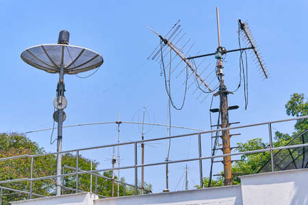 Radio and Satellite antennas on the blue skyの写真素材
