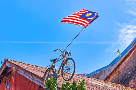 Bicycle in Georgtown city with Malaysian flag on the roof, Penang island