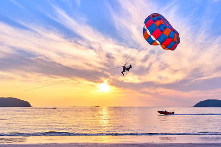 Parasailing at sunsetの写真素材