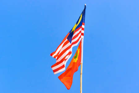 Malaysia flag with Kedah flag on the blue sky