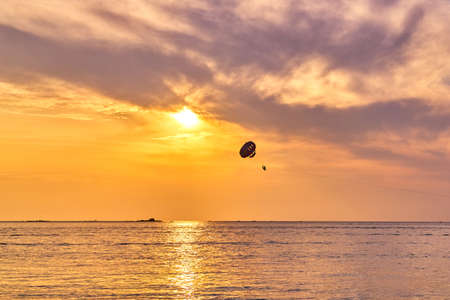 Parasailing at sunsetの写真素材