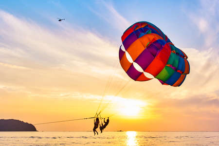 Parasailing at sunsetの写真素材