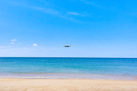 Plane is landing over waterの写真素材