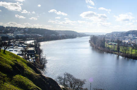 vltava/moldau river is entering prague behind the vysehrad castle.のeditorial素材