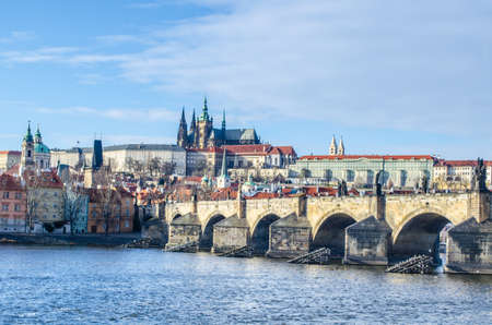 famous view of the prague castle and the charles bridge in prague which every year attracts milions of tourists from all around the world.のeditorial素材