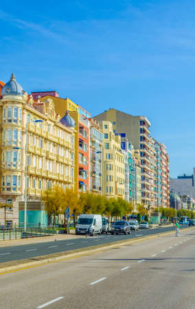 People are strolling through a street in Santander, Spain
