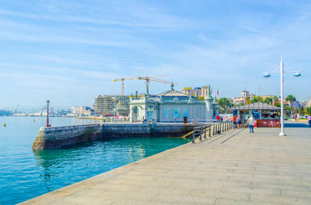 View of seaside promenade dominated by palacete del embarcadero in Santander, Spainのeditorial素材