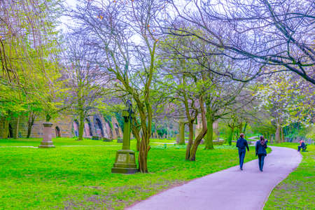 View of an ancient graveyard spread across saint james garden in Liverpool, Englandの写真素材