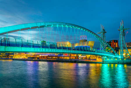 View of an illuminated footbridge in Salford quays during night in Manchester, Englandのeditorial素材