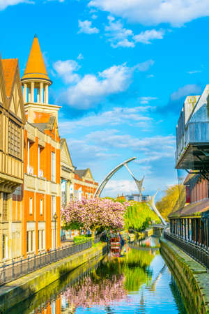 River Witham passes old brick buildings in central Lincoln, Englandの写真素材