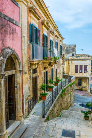 View of a narrow street in Modica, Sicily, Italyの写真素材