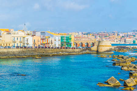 View of the seaside promenade surrounding the modern town of Syracuse in Sicily, Italyの写真素材