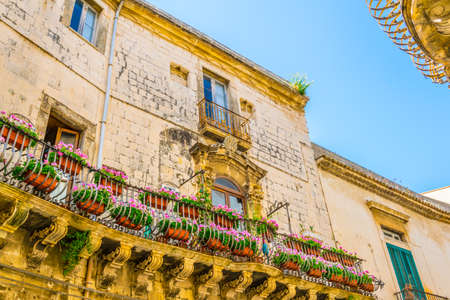 Facade of an old house in the old town of Syracuse, Sicily, Italy