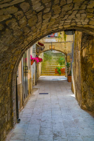 View of a narrow street in Modica, Sicily, Italyの写真素材