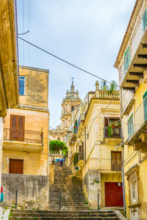 View of a narrow street in Modica, Sicily, Italyの写真素材