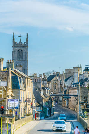 STAMFORD, UNITED KINGDOM, APRIL 9, 2017: Street leading to the Saint Martin church in Stamford,...