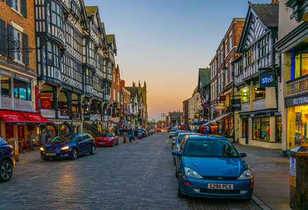 CHESTER, UNITED KINGDOM, APRIL 7, 2017: Sunset view of traditional tudor houses alongside the Bridge street in the central Chester, Englandのeditorial素材