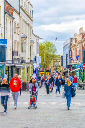 LINCOLN, UNITED KINGDOM, APRIL 10, 2017: People are walking on a street in Lincoln, England