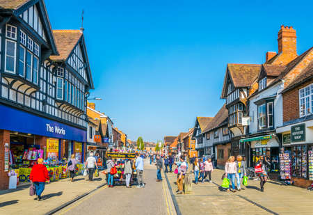 STRATFORD UPON AVON, UNITED KINGDOM, APRIL 8, 2017: People are strolling alongside traditional wooden houses in Stratford upon Avon, Englandのeditorial素材