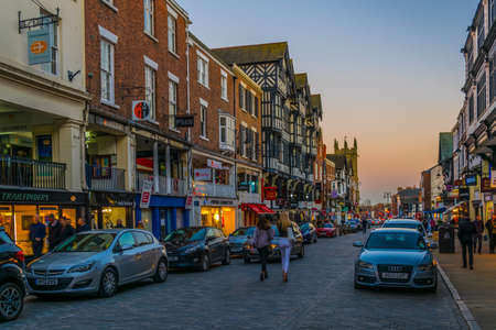 CHESTER, UNITED KINGDOM, APRIL 7, 2017: Sunset view of traditional tudor houses alongside the Bridge street in the central Chester, Englandのeditorial素材