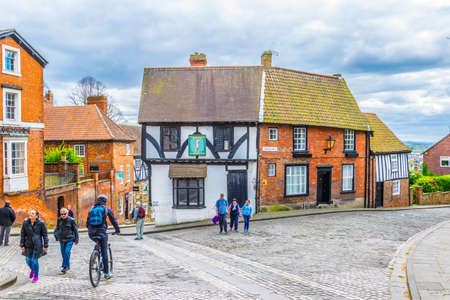 LINCOLN, UNITED KINGDOM, APRIL 10, 2017: People are walking on a street in Lincoln, Englandのeditorial素材