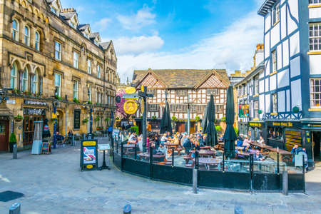 MANCHESTER, UNITED KINGDOM, APRIL 11, 2017: Restaurants full of people on the Shambles square in...