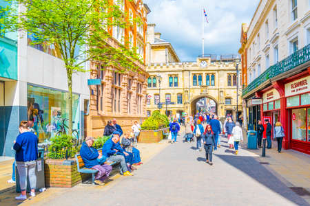 LINCOLN, UNITED KINGDOM, APRIL 10, 2017: People are walking towards Lincoln Guildhall, Englandのeditorial素材