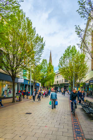 NOTTINGHAM, UNITED KINGDOM, APRIL 11, 2017: People are walking on a street in Nottingham, England