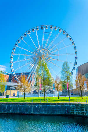 LIVERPOOL, UNITED KINGDOM, APRIL 7, 2017: ECHO convention center and an adjacent ferris wheel in Liverpool, Englandのeditorial素材
