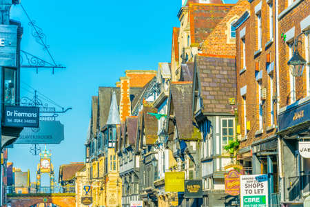 CHESTER, UNITED KINGDOM, APRIL 7, 2017: Traditional tudor houses alongside the Bridge street in the central Chester, Englandのeditorial素材