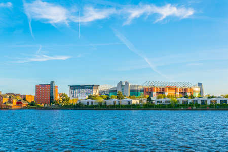 MANCHESTER, UNITED KINGDOM, APRIL 11, 2017: Old trafford stadium of Manchester United viewed over river Irwell, Englandのeditorial素材