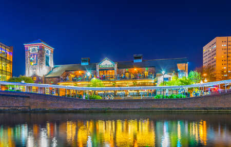 BIRMINGHAM, UNITED KINGDOM, APRIL 8, 2017: Night view of a restaurant alongside a water channel in the central Birmingham, Englandのeditorial素材