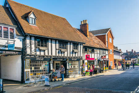 STRATFORD UPON AVON, UNITED KINGDOM, APRIL 8, 2017: People are strolling alongside traditional...