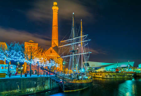 LIVERPOOL, UNITED KINGDOM, APRIL 5, 2017: View of a ship anchored in front of the pump house in Liverpool, Englandのeditorial素材