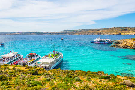 COMINO, MALTA, MAY 1, 2017: Tourist boats are anchoring near comino island, Maltaのeditorial素材