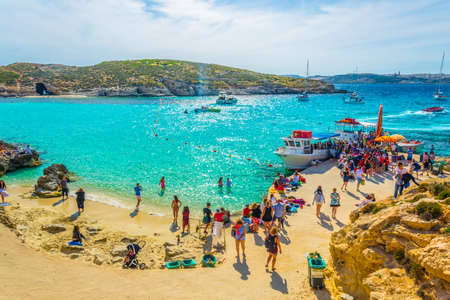 COMINO, MALTA, MAY 1, 2017: Tourists are enjoying turquoise water of the blue lagoon on the comino...